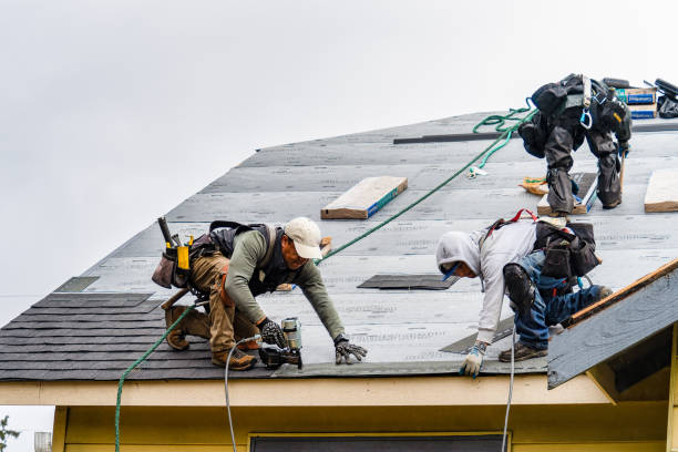 Professional Roofing technician working in Bayside, NY